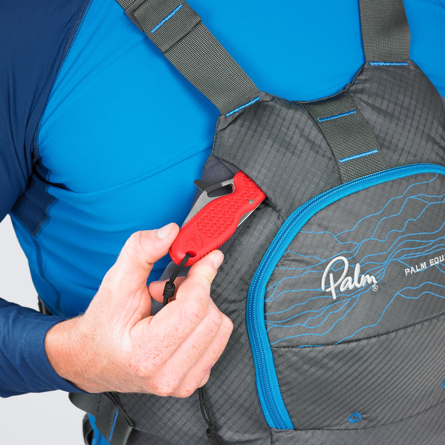 Palm Folding knife sliding into the Palm Riffs knife pocket