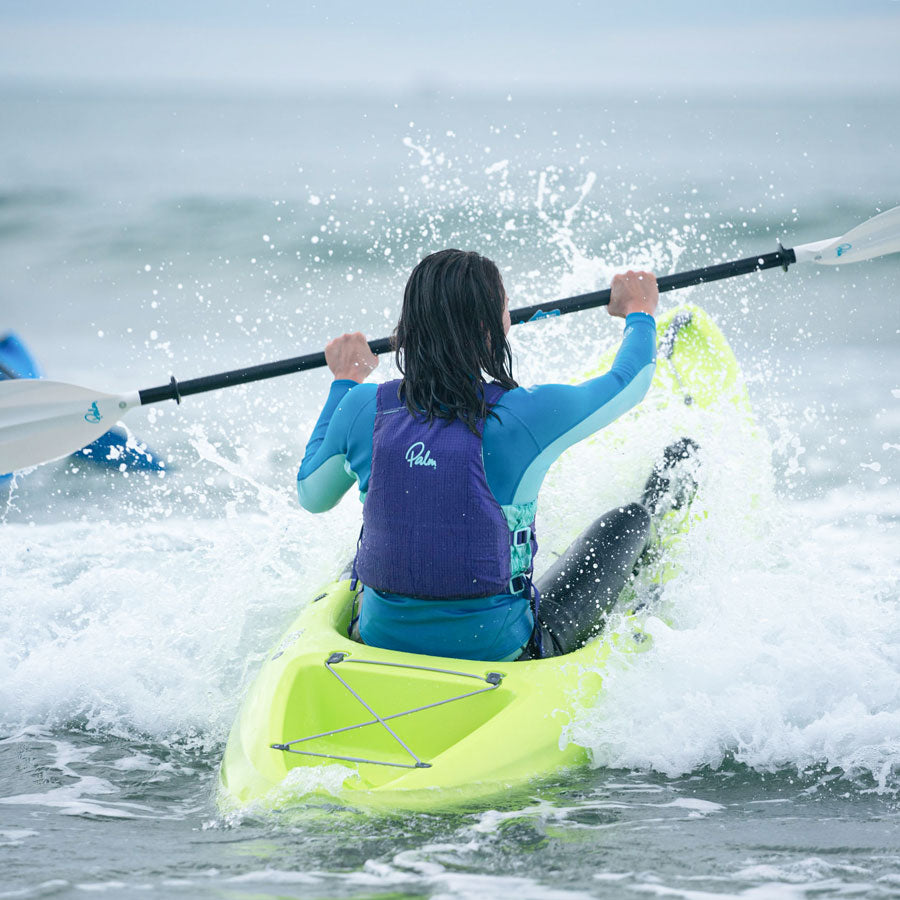 Islander Koa Sport punching out through surf.