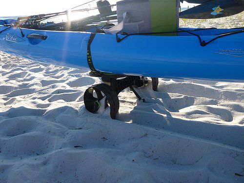 Railblaza C-Tug in use on sand hauling a Hobie Revolution Kayak