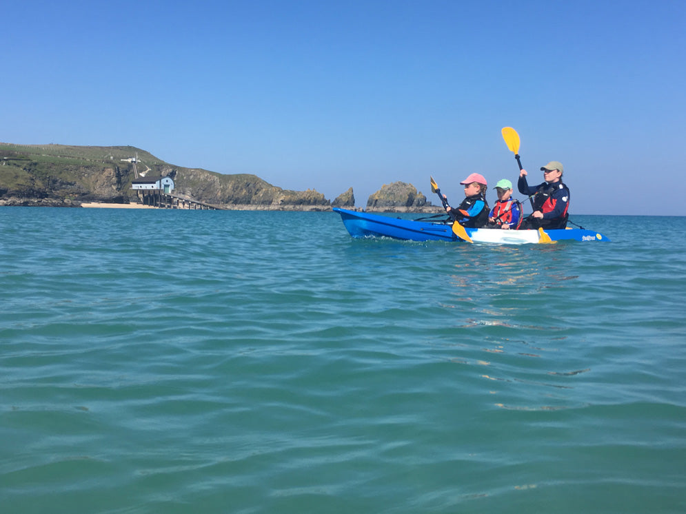 Feelfree Gemini Sport in Blue White Blue Deluxe Package paddling off the Lizard Lifeboat Station in Cornwall