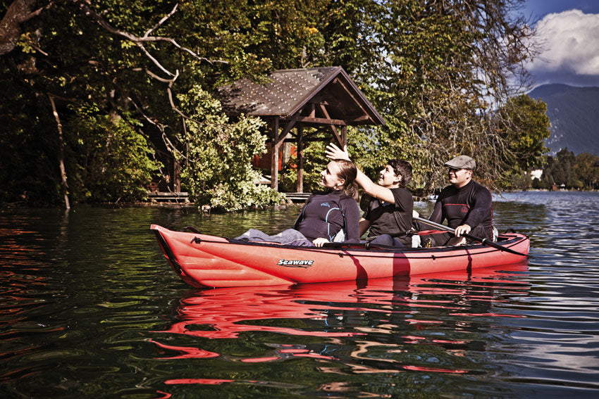 Gumotex Seawave being paddled by three people exploring a lake