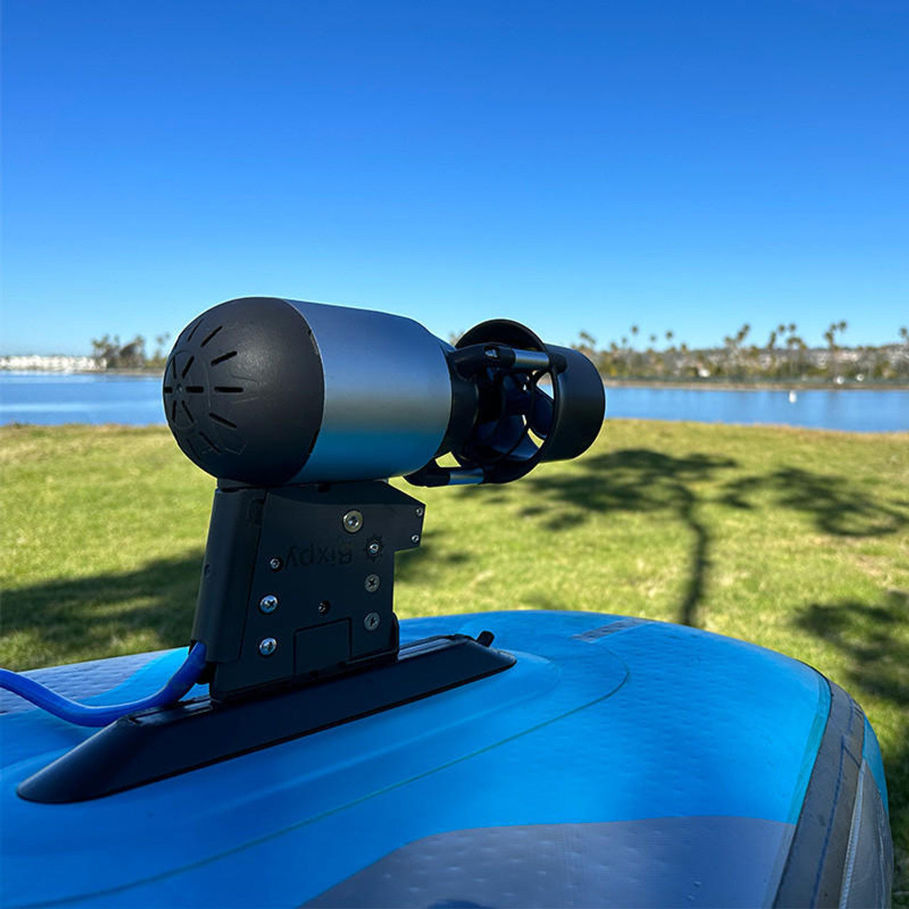 a close up of the bixpy k-1 motor shown on the underside of a Stand Up Paddleboard