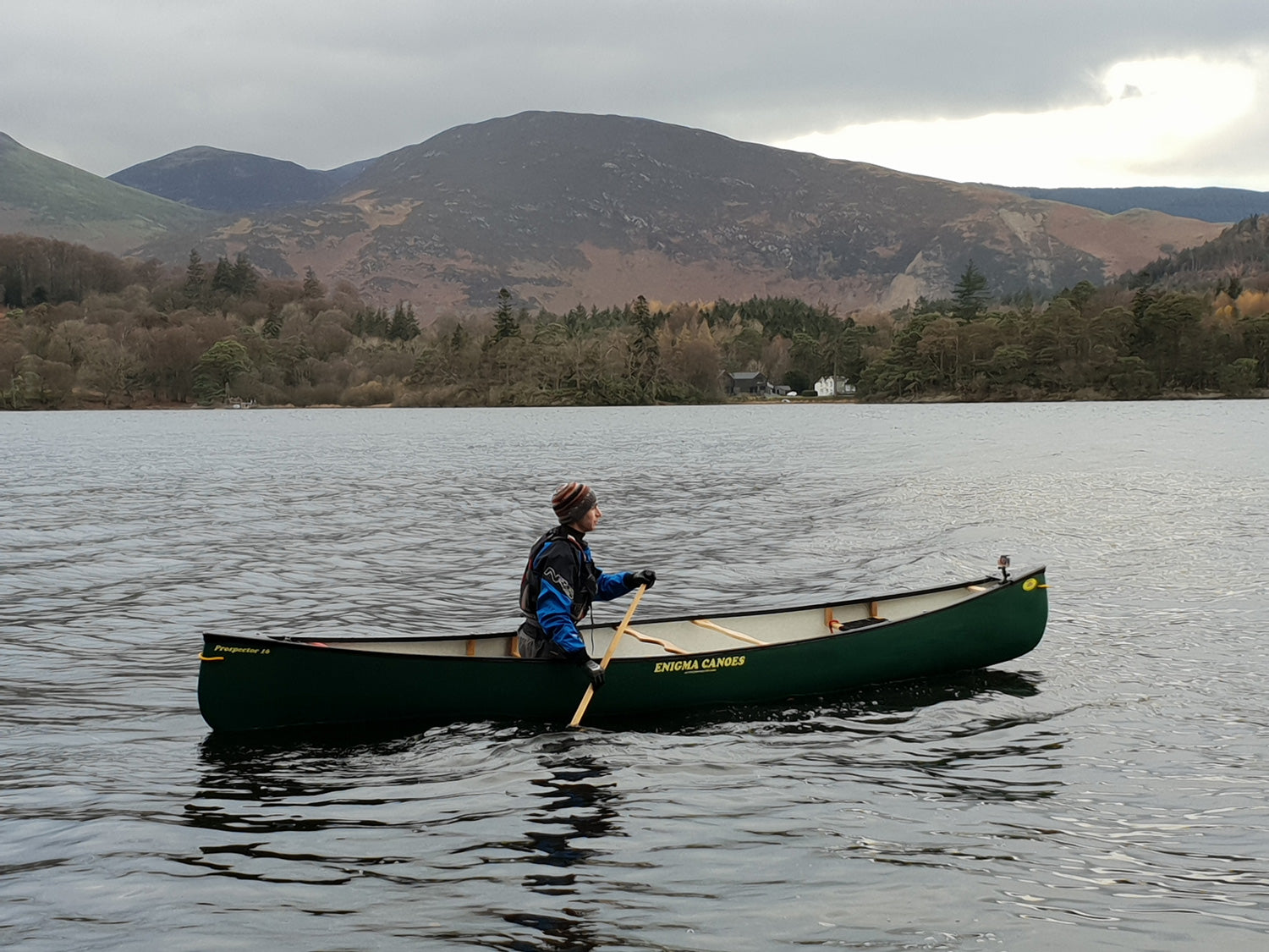 Solo paddling the Enigma Prospector 16 canoe on a lake